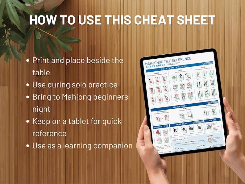 May include: A tablet displaying a Mahjong tile reference cheat sheet. The screen shows various tile types and game information. Text on the screen includes "MAHJONGG TILE REFERENCE CHEAT SHEET". The background is a wooden surface.