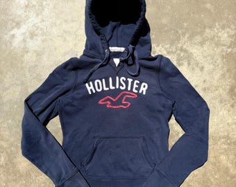 Sudadera con capucha y logo bordado azul marino para mujer de Hollister, década del 2000, talla grande.