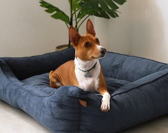 Ausgefallenes Hundebett aus Cord mit Nackenstütze