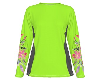 May include: A long-sleeved shirt with a bright green body and gray sleeves. The sleeves feature a watercolor floral design with pink, purple, and blue flowers.