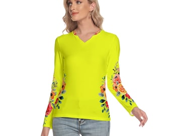 May include: A bright yellow long-sleeved shirt with a V-neck and floral print on the sleeves.