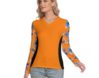 May include: A long-sleeved shirt with a V-neck and a floral print on the sleeves. The shirt is orange with black accents on the sides.