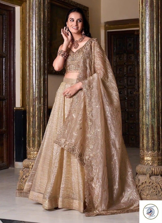 champagne indian wedding dress Champagne Beige Embroidered Wedding Lehenga Choli Unstitched