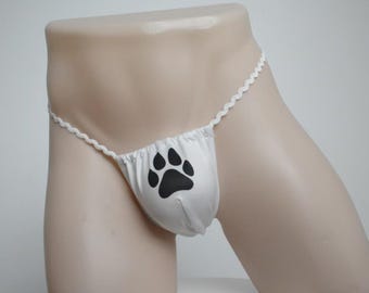 Tanga para hombre con estampado de huellas de patas: lencería original con motivos de animales y un estilo minimalista y divertido.