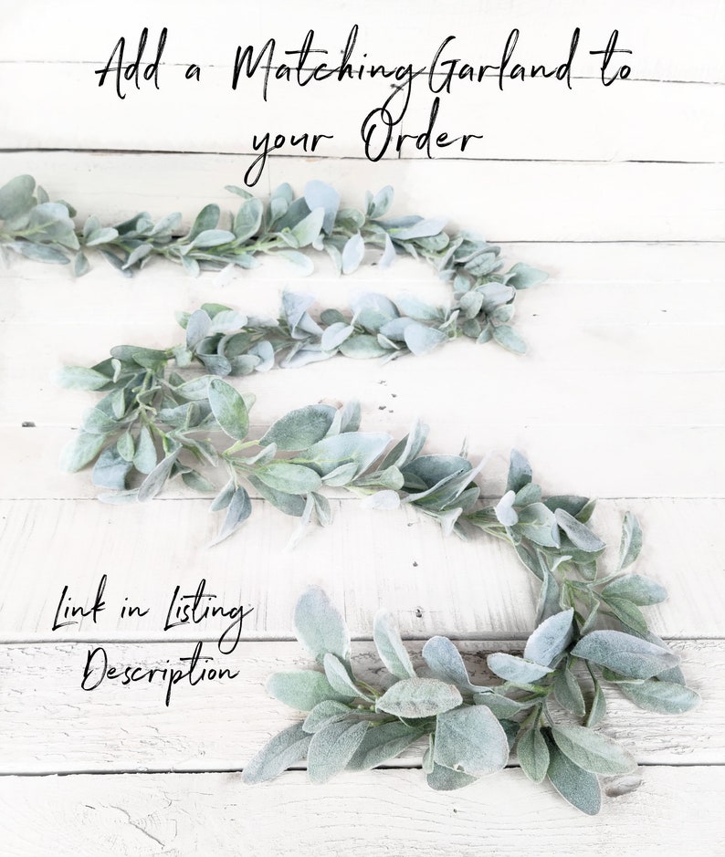 May include: A close-up of a garland of faux lambs ear leaves on a white wooden background. The text "Add a Matching Garland to your Order" is at the top of the image. The text "Link in Listing Description" is at the bottom of the image.