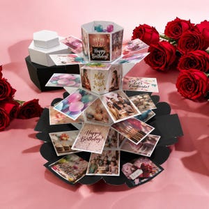 May include: A multi-tiered, hexagonal birthday explosion gift box featuring various photo panels, birthday-themed graphics, and text including Happy Birthday, Make a Wish, and Let's Celebrate, surrounded by red roses and a black and white box base.