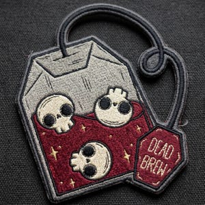 Dead Brew - Skull Tea Bag Patch | Goth Tea Lover Embroidered Badge | Spooky Coffin Tag Iron-On for Jackets, Bags & Vests