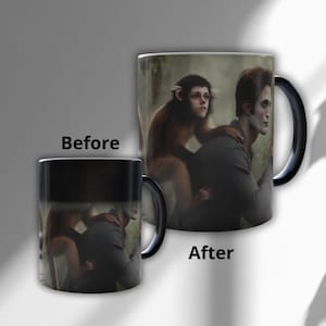 May include: A black heat-sensitive mug with a black handle. The mug's design changes when hot liquid is added. The "Before" image shows a black mug, while the "After" image reveals a scene with two people and a monkey.