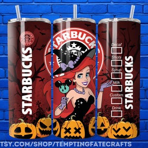 A Starbucks can with a cartoon mermaid character on it, along with Halloween-themed pumpkins and bats.