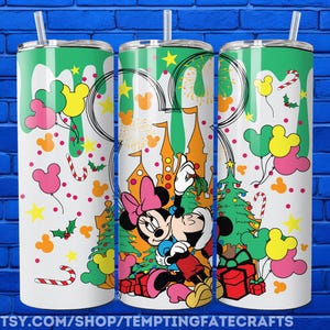 A collage of three colorful tumblers featuring Minnie Mouse and Mickey Mouse characters, along with various Disney-themed elements such as snowflakes, stars, and presents.