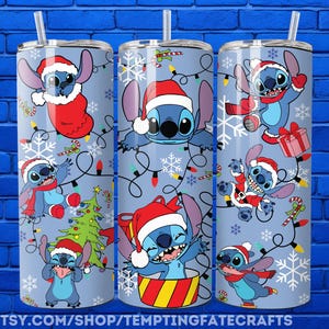 A collection of three cylindrical tumblers with Christmas-themed designs featuring Stitch, a popular character from the Disney animated film "Stitch". The tumblers are decorated with various Christmas-themed elements such as snowflakes, Christmas trees, and presents.