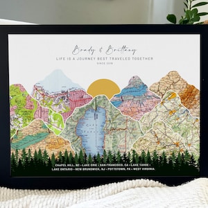 May include: A framed print with a map-style design featuring mountains made of different colored maps. The text "Brady & Brittany" and "Life is a journey best traveled together since 2018" is at the top of the print. The bottom of the print lists locations including Chapel Hill, NC, Lake Erie, San Francisco, CA, Lake Tahoe, Lake Ontario, New Brunswick, NJ, Pottstown, PA, and West Virginia.