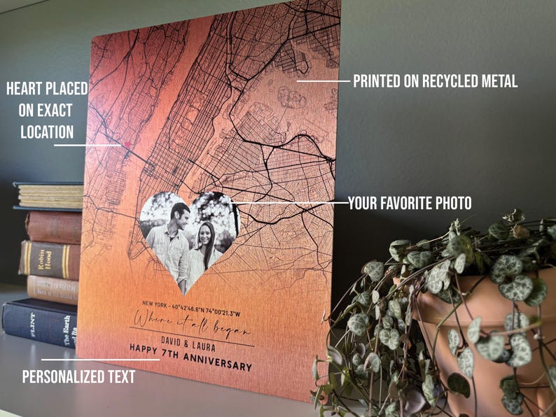 May include: A personalized metal print with a map of New York City. The print features a heart-shaped photo of a couple and the text "Where it all began." The print is printed on recycled metal and has a personalized text section.