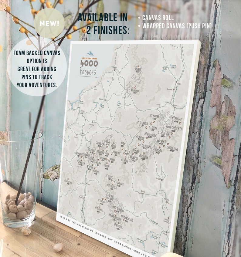 May include: A map of New Hampshire's 4,000 footers, showing the location of each mountain peak. The map is printed on a canvas with a white background and brown text. The map is available in two finishes: canvas roll and wrapped canvas with push pins.