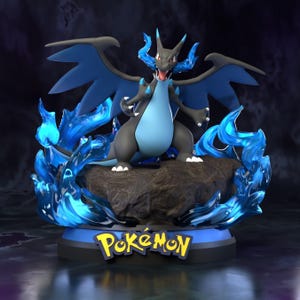 May include: A detailed figurine of Charizard, a Pokémon character, in a dynamic pose. The figure features a black and light blue color scheme with blue flames and wings. The base includes the Pokémon logo.