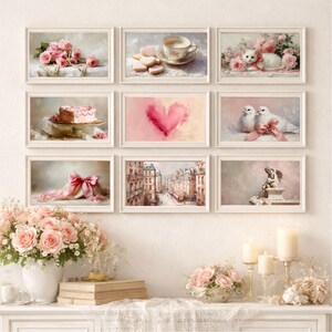 May include: Nine framed art prints with romantic themes. The prints feature images of roses, a teacup, a white cat, a cake, a heart, doves, a pink bow, a Parisian street scene, and a statue of an angel. The color palette is soft pink and white.