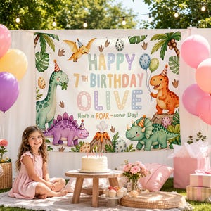 May include: A white fabric backdrop featuring colourful illustrations of dinosaurs wearing party hats, palm trees, a volcano, and eggs. The text reads Happy 7th Birthday Olive Have a ROAR-some Day in pastel colours. The banner is surrounded by balloons.