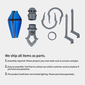 May include: A collection of disassembled decorative components in blue and grey. The main piece is a blue vase-like shape with a brown cross design. Other parts include a ring, curved elements, and vertical supports. The image text reads, "We ship all items as parts."