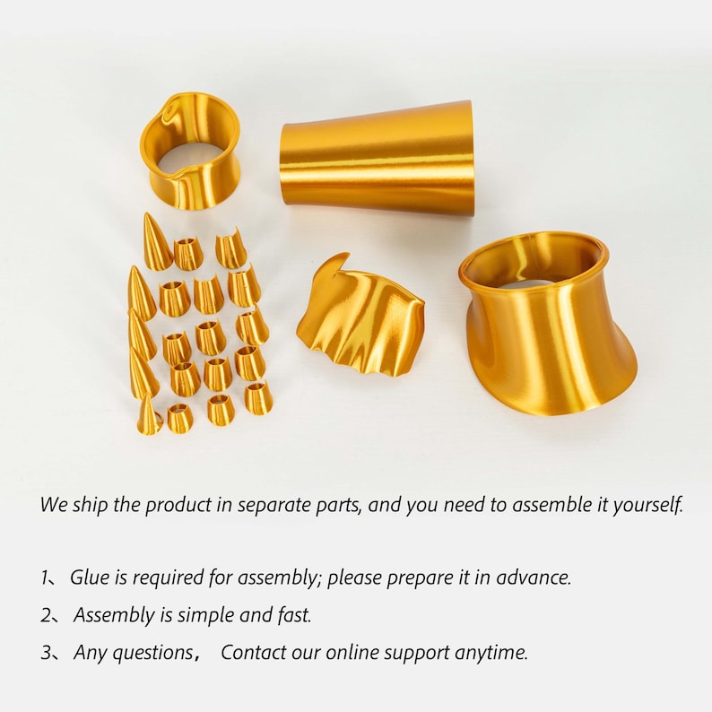 Puede incluir: Un conjunto de componentes met&aacute;licos de color dorado que incluye dos anillos grandes acampanados, una pieza cil&iacute;ndrica c&oacute;nica, un segmento ondulado y diecis&eacute;is piezas peque&ntilde;as c&oacute;nicas y cil&iacute;ndricas, que requieren ensamblaje con pegamento.