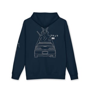 May include: Navy blue hoodie featuring a white outline graphic of a samurai warrior with a sword, standing behind a car. The text "アキュラ RSX" is printed on the back. The hoodie has a hood and a front pocket.