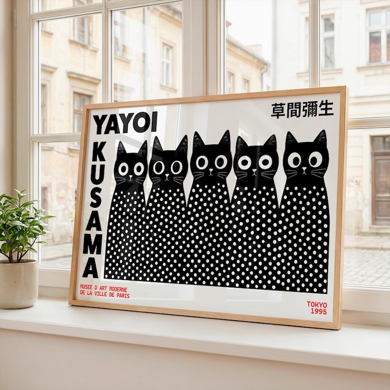May include: A framed rectangular art print featuring five black cats with white polka-dot bodies and large white eyes. The text YAYOI KUSAMA and Japanese characters are printed in black. The bottom includes MUSEE D ART MODERNE DE LA VILLE DE PARIS and TOKYO 1995.