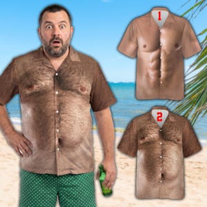 May include: A man wearing a brown short-sleeved shirt printed with a hairy chest design, with a surprised expression. Two additional shirts with similar designs are displayed. The background shows a beach scene.