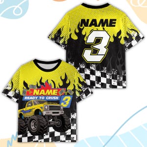 Peut inclure: T-shirt graphique jaune et noir avec un motif de monster truck. Le t-shirt comprend le chiffre 3, des flammes et le texte "NAME READY TO CRUSH". Le dos du t-shirt affiche &eacute;galement le chiffre 3 et le mot "NAME".