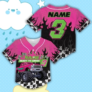 May include: Pink and black baseball jersey with a monster truck graphic. The jersey features the word "NAME" and the number "3" in green. The design includes flames and a checkered flag pattern.