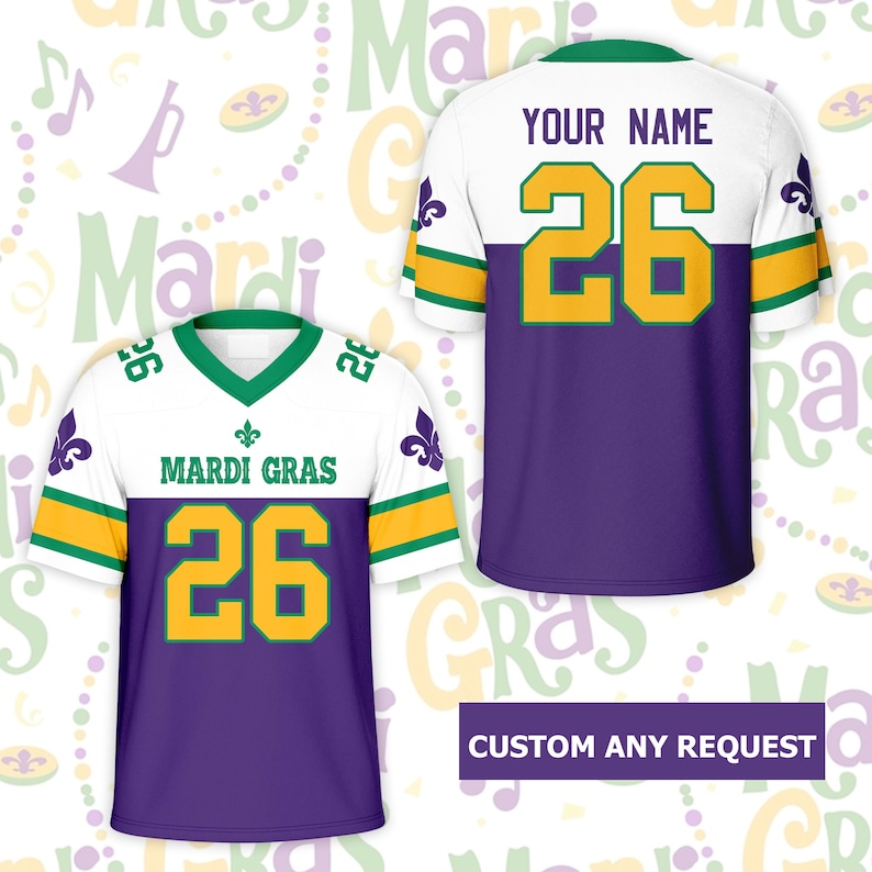 May include: A white, purple, and gold Mardi Gras jersey with the number 26 in gold. The jersey has green accents and the words "MARDI GRAS" across the chest. The back of the jersey has the number 26 and space for a name.