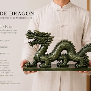 May include: A hand-carved dark nephrite jade dragon sculpture measuring 50 cm (20 in) in length, 26 cm (10 in) in height, and 11 cm (4.3 in) in depth. The piece weighs 5.2 kg (11.5 lb) and features detailed scales and a fierce expression.