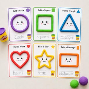 May include: Six educational cards featuring Play-Doh shapes: a purple circle, green square, blue triangle, red heart, yellow star, and orange rectangle. Each card shows the shape, a smiling face, the word to trace, and a small Play-Doh container icon.