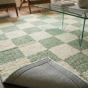 Hand tufted wool rug in neutral beige and grey
Modern living room area rug with soft texture
Plush hand tufted carpet for luxury interiors