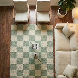 Neutral tone rug for bright living room
Handmade tufted rug for modern homes
Stylish living room carpet design