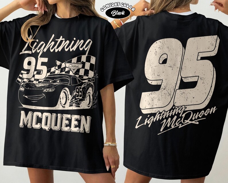May include: Black Lightning McQueen t-shirt with a distressed graphic of the race car and the number 95. The front of the shirt features the text "Lightning McQueen" and "95". The back of the shirt has a large "95" and "Lightning McQueen" text.