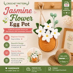 May include: A crochet pattern for a Jasmine Flower Egg Pot. The image shows a hanging orange egg-shaped pot with white jasmine flowers, green leaves, and stems. Text includes "Jasmine Flower Egg Pot" and "Finished Size Approx. 12 cm (H) 8 cm (W)."