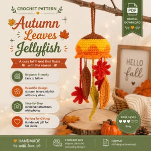 May include: A crochet pattern for an Autumn Leaves Jellyfish, featuring a digital download PDF. The jellyfish is crafted with yellow, orange, and brown yarn, adorned with hanging leaf-shaped crochet pieces. Finished size is approx. 24cm in height.