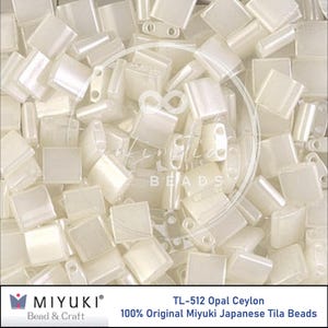 May include: A collection of off-white, rectangular Miyuki Tila beads. The beads are scattered, showing their flat, square shape and two holes for stringing. The image includes the text "TL-512 Opal Ceylon" and "100% Original Miyuki Japanese Tila Beads".