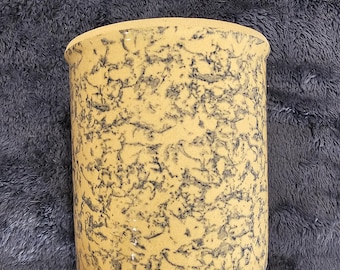 Pottery canister with beige with blue speckles is a stylish and functional addition to any kitchen.