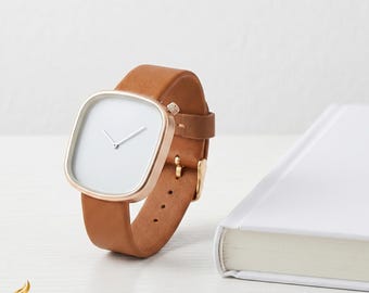 Orologio quadrato ultrasottile e minimalista con cinturino in pelle, elegante orologio al quarzo per uomo e donna.