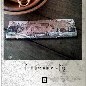 May include: A punch needle or needlework pattern for a primitive winter scene featuring a pig, a small house, and trees. The pattern is titled "Primitive winter - Pig" and is designed by Kate Gillery. The pattern is 10 1/2 inches by 3 inches.
