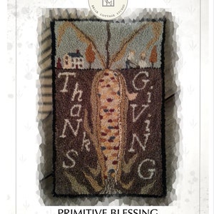 May include: A punch needle pattern featuring a corn stalk with the word "Thanksgiving" spelled out around it. The pattern is on a brown background with a small house and trees in the background. The pattern is titled "Primitive Blessing" and is designed by Kate Gillery.