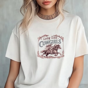 May include: A white ceramic mug with a black handle and the text "But First, Coffee" in a handwritten style. The mug is on a white surface. The mug is 4 inches tall.