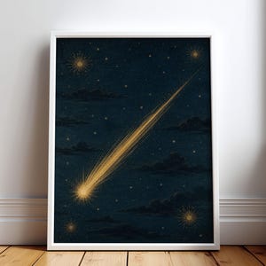 May include: A framed vertical wall art print featuring a dark navy blue night sky filled with scattered stars and dark clouds. A bright golden comet with a long, streaking tail stretches diagonally across the center of the composition.