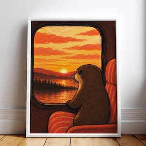 Könnte beinhalten: Ein gerahmter Kunstdruck, der einen braunen Otter auf einem rot-orange gestreiften Stuhl zeigt, der aus einem Zugfenster auf einen Sonnenuntergang über einem See, Bergen und einem Wald blickt. Der Himmel ist voller leuchtend orangefarbener Wolken.