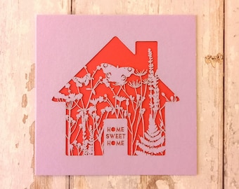 Tarjeta de bienvenida para nuevo hogar cortada con láser, color lavanda y coral