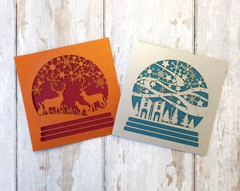 Juego de tarjetas navideñas con bolas de nieve cortadas con láser: diseño festivo hecho a mano con recortes de papel
