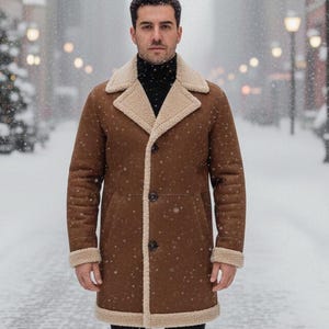 May include: A brown shearling coat with a cream-colored lining and trim. The coat has a button-up front and is worn over a black turtleneck. The background shows a snowy street with Christmas trees and streetlights.