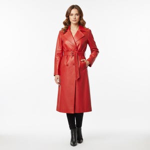 May include: A full-length, red leather trench coat with a belted waist and notched lapels. The coat features a double-breasted design and is worn with black pants and boots. The coat's length extends to the ankles.