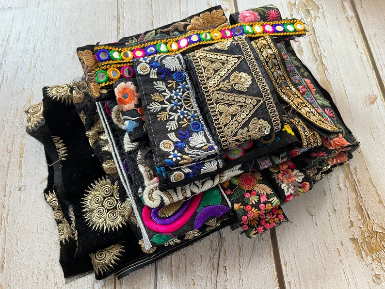 May include: A collection of colorful embroidered trim and ribbon with gold and silver accents. The trim is perfect for adding a touch of handmade detail to clothing, bags, and home decor projects.