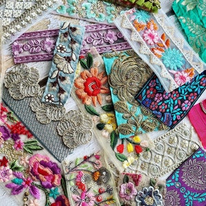 May include: Assortment of colorful embroidered trim with floral and geometric patterns. The trim is made of lace, tulle, and other fabrics. The trim is perfect for adding a touch of elegance to any project.